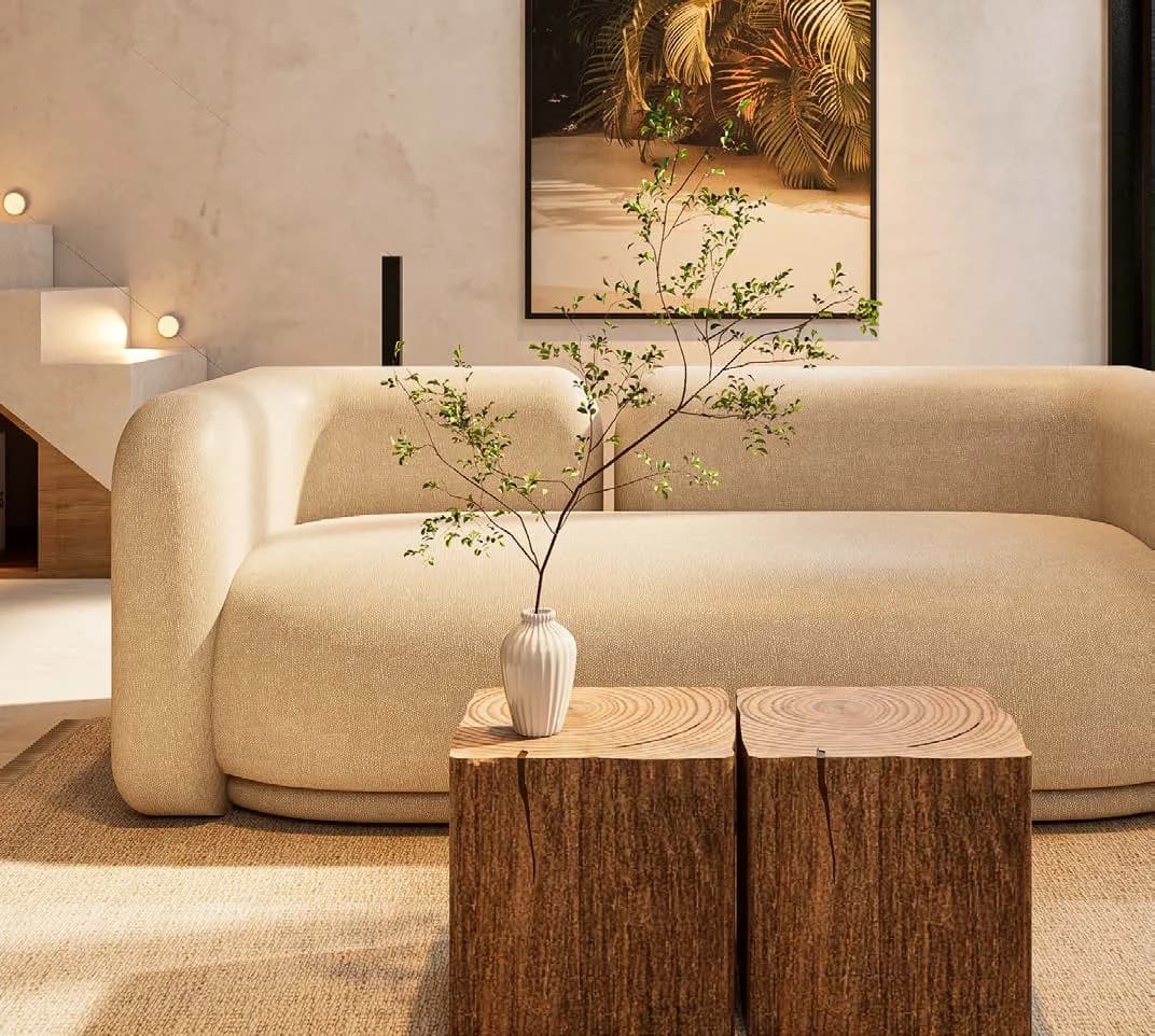 Furnished living room of a villa in the development, with a sofa and natural light