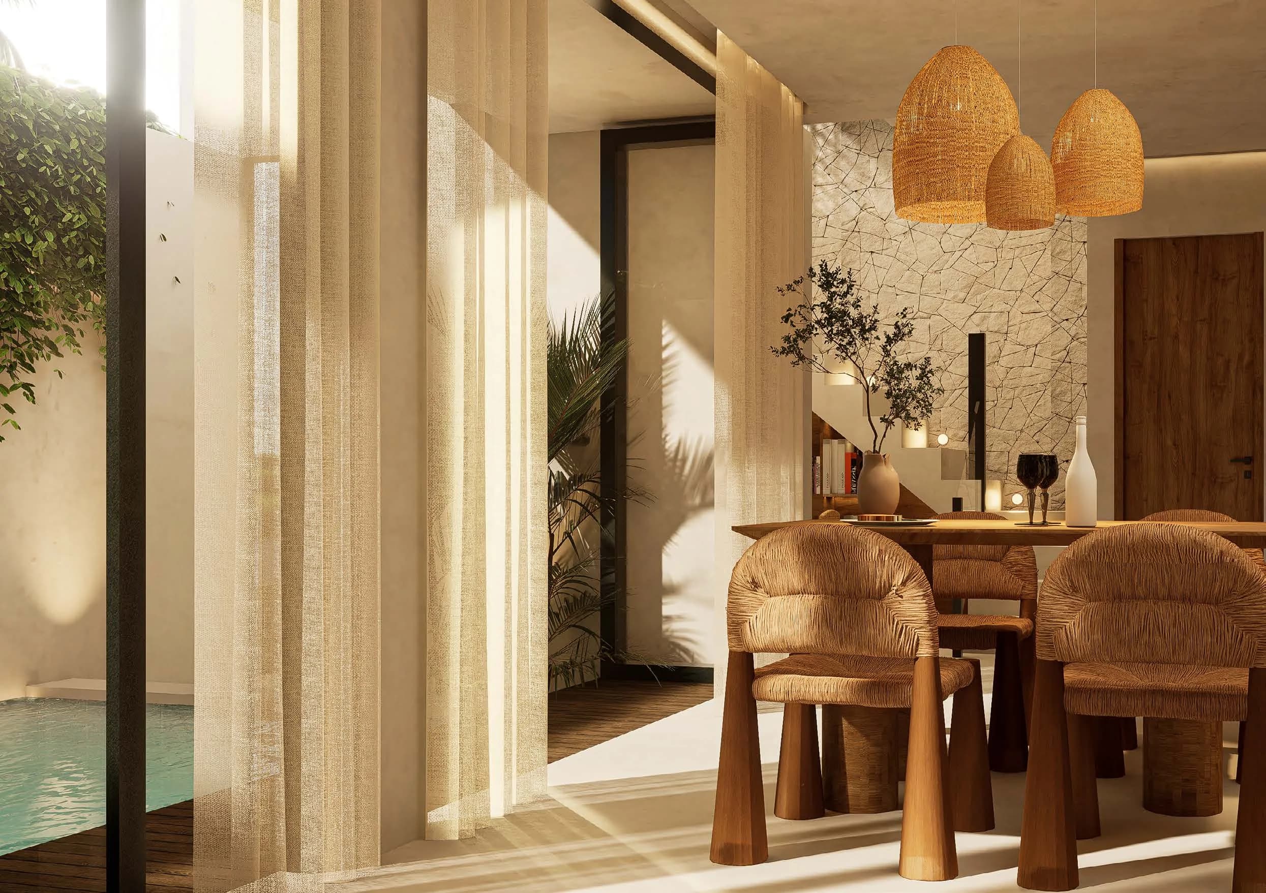 Dining room opening onto a pool, two-bedroom villa in the development