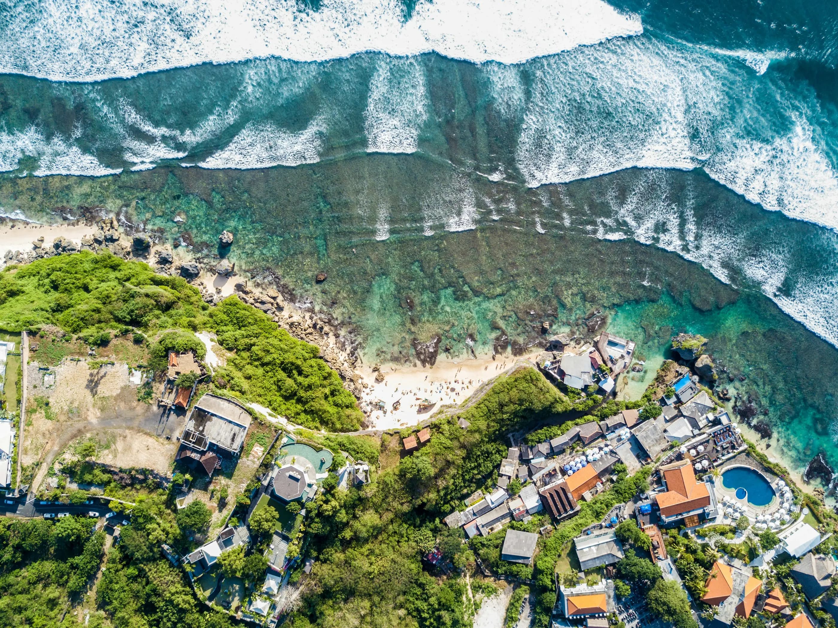 Aerial view of the Uluwatu coastline, reef and vegetation, in Bali