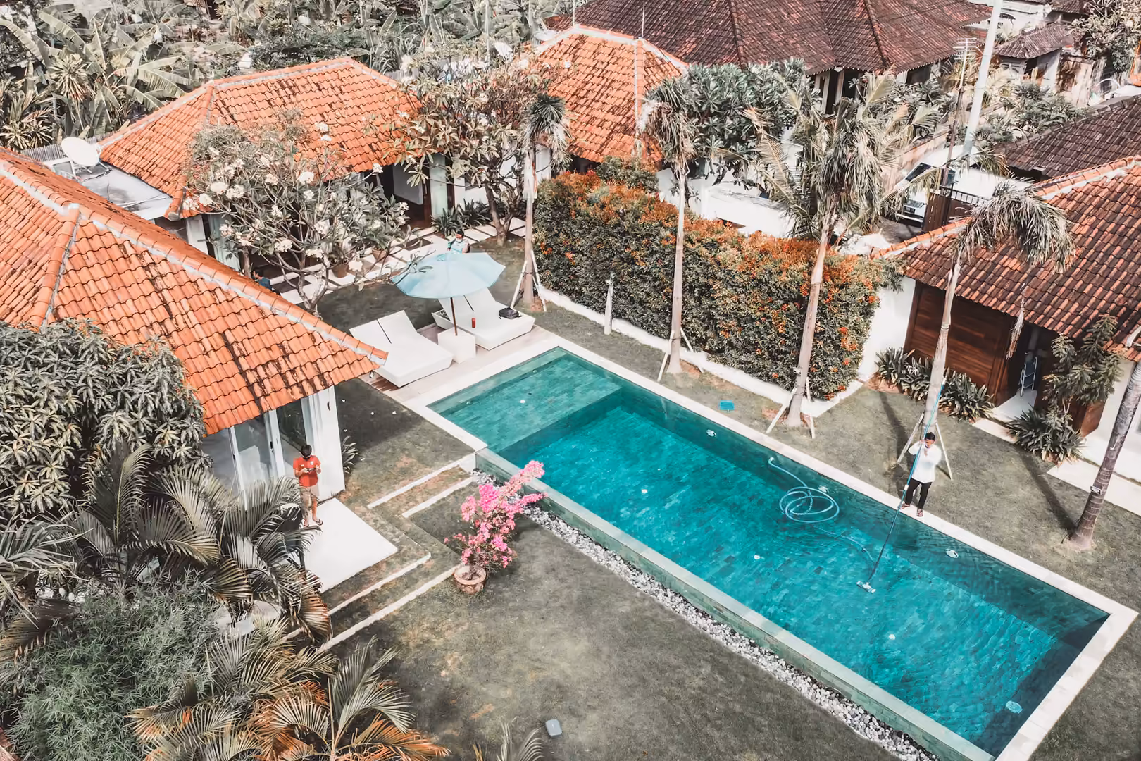 Villas and a pool seen from the air in Sanur, Bali